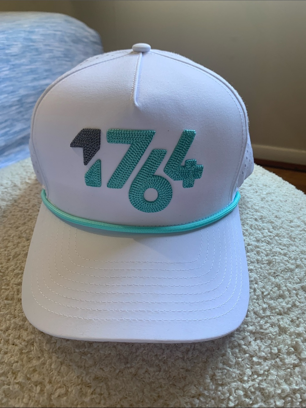 White Trucker Hat with Teal Accent and '1764' Embroidery